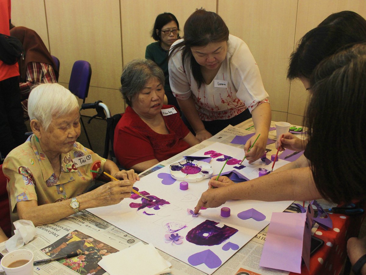 Crafting posters for Aphasia SG's participation in Purple Parade